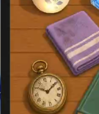 Detail of the source frame: a folded purple towel and a pocket watch on a wooden table